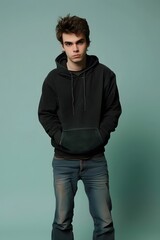 Wall Mural - Young Man in Black Hoodie and Jeans