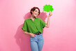 © deagreez - Photo portrait of pretty young girl hold paper cloud dressed stylish green outfit isolated on pink color background