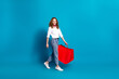 Photo portrait of pretty young woman hold shopping bags walking dressed stylish white clothes isolated on blue color background