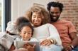 Mother, father and daughter with tablet for education, gaming or streaming on sofa of living room in home. Smile, tech and black family with girl kid in apartment for homework or online research