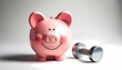 © NanzXy - piggy bank with dumbbell symbolizing financial health and saving strategy Concept of personal finance management and economical growth