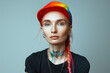 Portrait of Young activist woman smiling and wearing rainbow hat symbol of Lgbtq+ social movement concept 