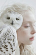 Charismatic albino girl with a white polar owl