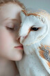 Charismatic albino girl with a white little owl