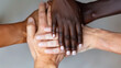 © otter2 - Close-up of diverse hands together, skin tones vary from light to dark, symbolizing unity