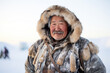 Cheerful Inuit man in hooded fur parka in Arctic region