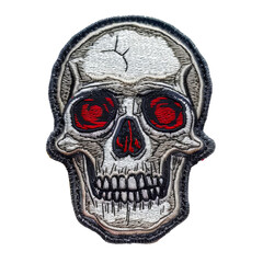 Embroidered skull patch with red eyes and teeth
