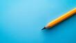 a pencil on a blue background with copy space