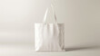 White blank tote bag mockup on white background.