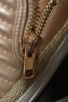 Close Up Photo Of The Zipper Of A Shoe