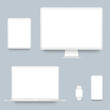 White desktop computer, laptop, smartphone, tablet and smart watch
