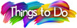 Things to do paper word sign with colorful spectrum paint brush strokes over white.