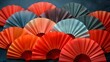 Oriental paper fans background. Colorful Japanese backdrop