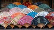Oriental paper fans collection background. Japanese store display