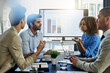 © peopleimages.com - Business people, screen and discussion with team in meeting, presentation or conference at office. Group of employees with finance graph, chart or data in collaboration, company investment or revenue