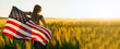 America celebrate 4th of July. Independence Day. Young woman holding bengal fire with American flag at sunset.	
