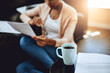 © peopleimages.com - Reading, paperwork and person in home with coffee and relax with review of investment report. Wealth, savings or woman with plan for future, income and learning from bills, taxes or research info