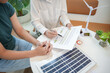 © Charlie's - Solar panels green energy Business people working in green eco friendly office business meeting creative ideas for business eco friendly professional teaching corporate people sustainable electricity