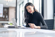 © Charlie's - Beautiful confident asian business woman working with laptop Hands typing  keyboard. Professional investor working new start up project. business planning in office. Technology business