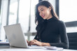 © Charlie's - Beautiful confident asian business woman working with laptop Hands typing  keyboard. Professional investor working new start up project. business planning in office. Technology business
