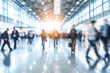 © Aisyaqilumar - A blurry image of an expo of convention lobby busy with people walking around.