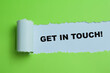 Concept of Get in Touch Text written in torn paper.