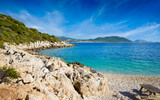 Fototapeta  - Serene Kas beach in Antalya Province of Turkey with clear Mediterranean sea