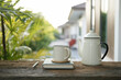 white enamel teapot and white ceramic cup
