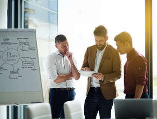 Poster - Businessman, tablet and meeting with team for collaboration, planning or strategy at office. Man or group of employees working together on technology for brainstorming, ideas or research at workplace