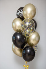 Wall Mural - black and gold balloons for men, inscriptions on the balloons: “wise master”, “True master”