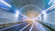 Tunnel effect and blurred light trails, abstract background.