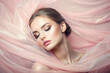 beautiful young woman in pastel pink color silk veil. Sensual Girl with make-up