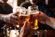 © seanzheng - generated illustration closeup of hands toasting beer glasses in bar with friends during evening party