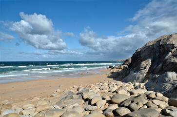 Wall Mural - Beach and cliff on the rocky wild coast of the peninsula of Quiberon in the Morbihan department in Brittany in north-western France