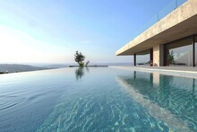 A Spacious Swimming Pool Located Beside A Contemporary Building With Minimalist Design, A Contemporary Villa With Minimalist Design And Infinity Pool