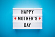 Lightbox on a light blue background with text on it: mother's day