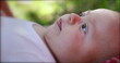 © Marco - Baby newborn lying on grass outside dreamy