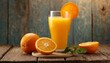 glass of orange juice on wooden table