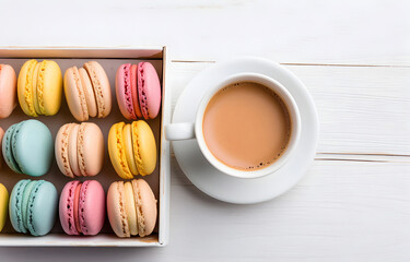 Wall Mural - colorful macarons in white box and coffee cup on white wooden ta