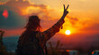 Woman Making Peace Sign Against Vibrant Sunset Sky