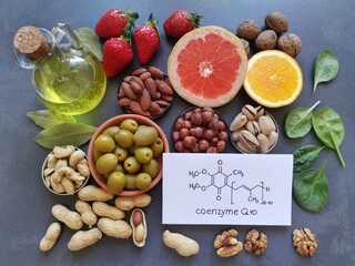 Wall Mural - Foods with Coenzyme Q10. Natural food sources rich in CoQ10 include: berries, nuts, citrus fruit, spinach. Coenzyme Q10 is vital for energy production in cells. Chemical formula of Coenzyme Q1O, CoQ10