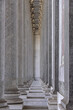 Elegant colonnade of Saint Paul Outside the Walls (Basilica Papale di San Paolo Fuori le Mura), Rome; symmetrical view with intricate detailing and marble textures under soft light. Rome, Italy