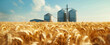 A field of golden wheat with modern grain silos in the background, representing global food production and agricultural advertising concept