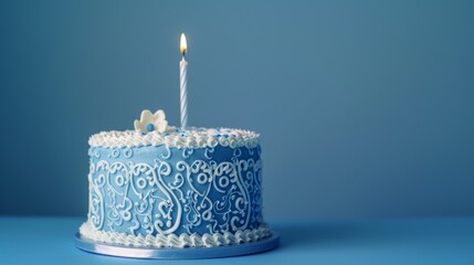 Wall Mural - Elegant blue birthday cake with lit candle