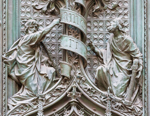 Wall Mural - MILAN, ITALY - SEPTEMBER 16, 2024: The detail from main bronze gate of the Cathedral -   St. Joseph and King David -  by Ludovico Pogliaghi (1906).