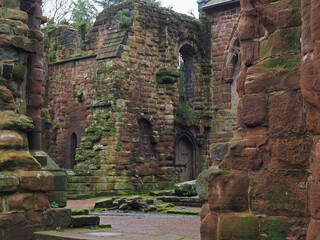 Ruined medieval stone walls of the eastern end of destroyed choir and tower of St Johns church in Chester