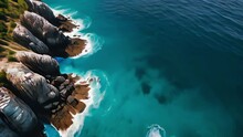 View From A Drone Of The Shore Of Blue Oceans Washing The Rocks