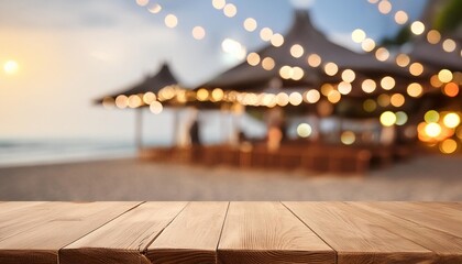 Sticker - wooden table and blur beach cafes background with bokeh lights high quality photo