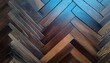 a detailed shot of a brown hardwood floor with a chevron pattern showcasing the beauty of wood stain and tints and shades on each plank of lumber