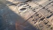close up of carved hieroglyphs on a stone surface illuminated by the warm glow of evening sunlight